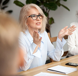 Teacher speaking at a meeting